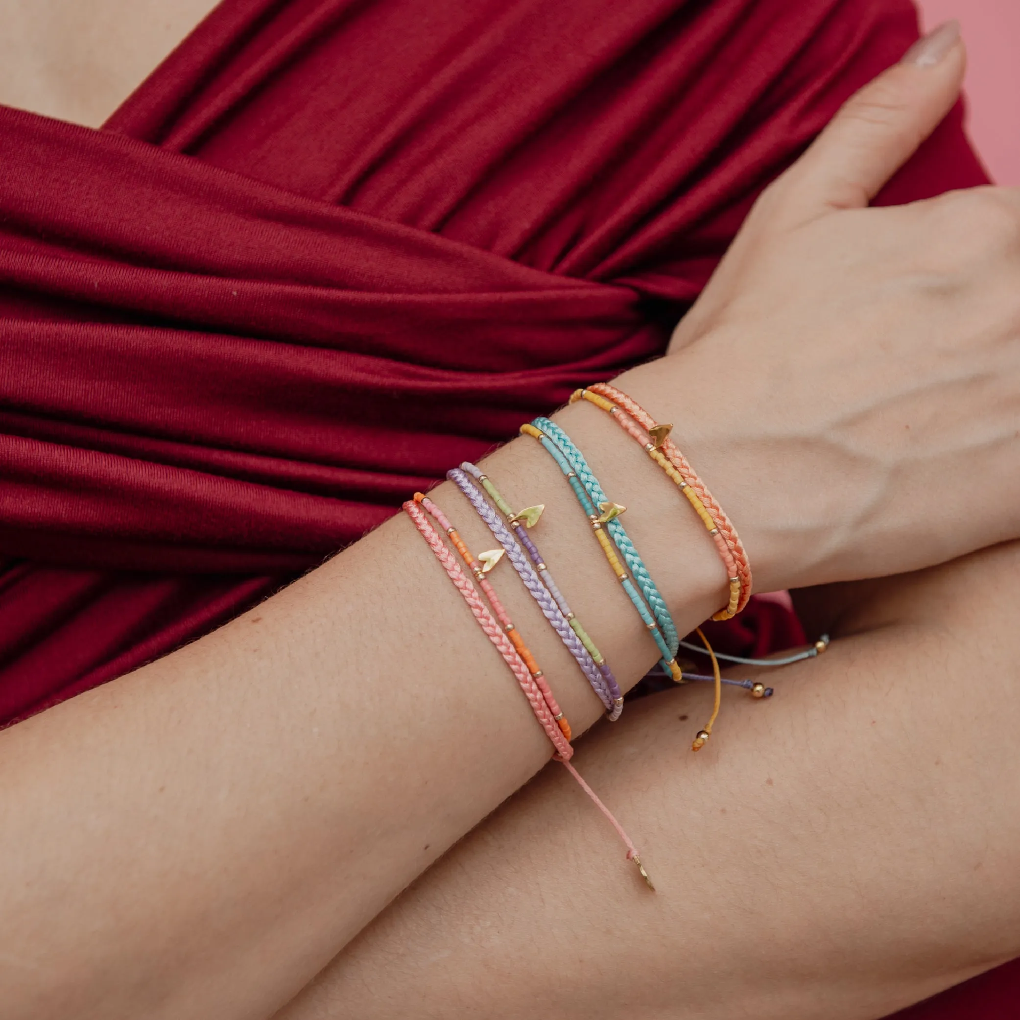Braided bracelet with a playful gold plated heart charm