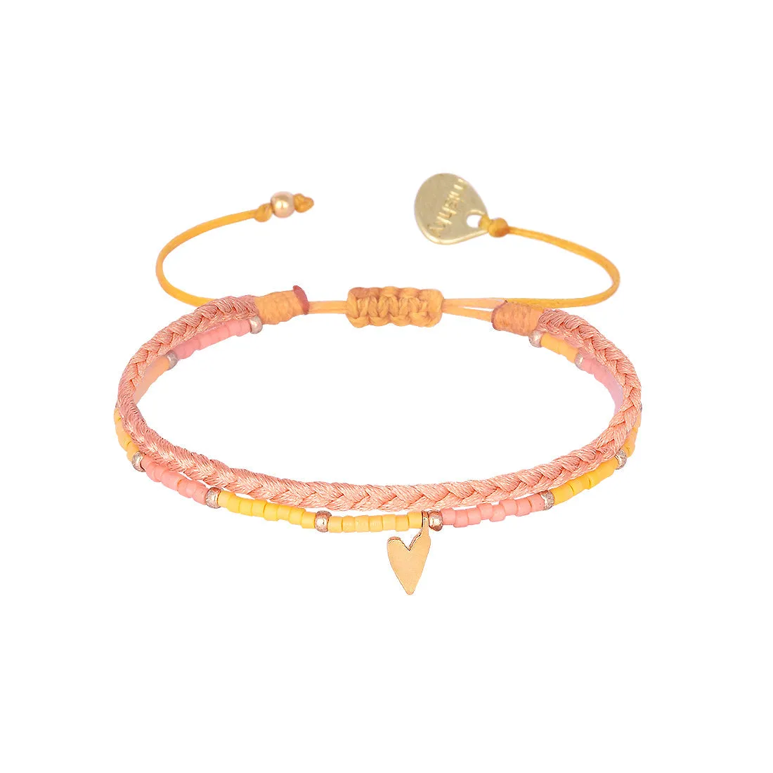 Braided bracelet with a playful gold plated heart charm