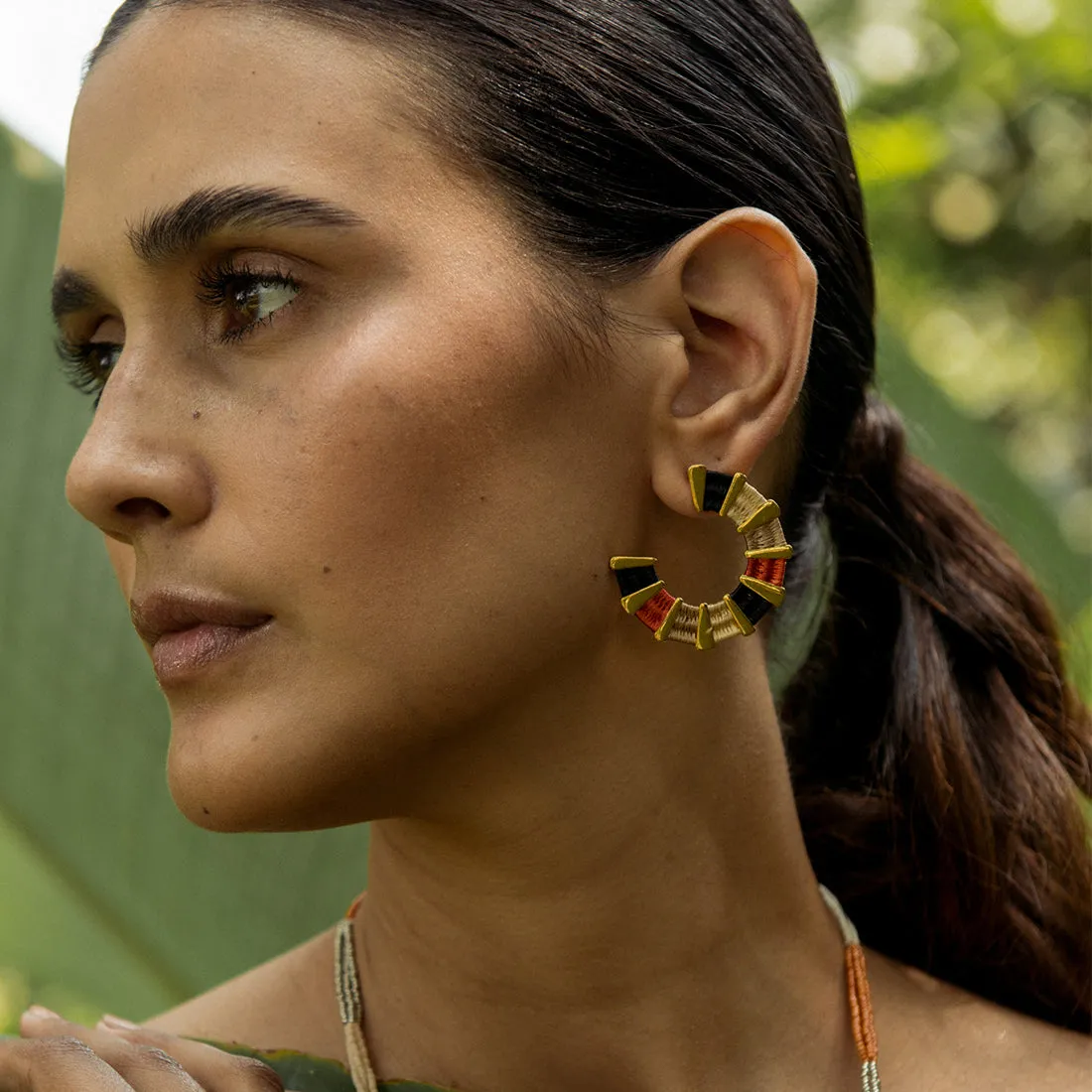 Hoop gold plated earrings in woven design